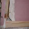 Figure 2: Detachment of plasterboard from timber frame at lower corner of wall at maximum cyclic displacement.